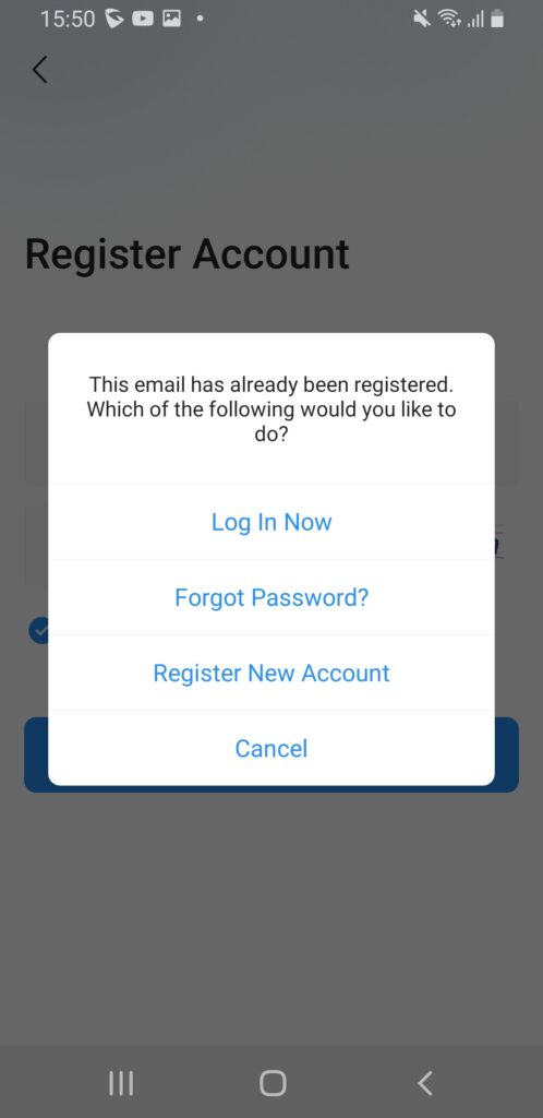 Screenshot_20260513-155035_GS Home - Documentation Center Modal dialog: Email already registered with options Log In Now, Forgot Password?, Register New Account, Cancel.