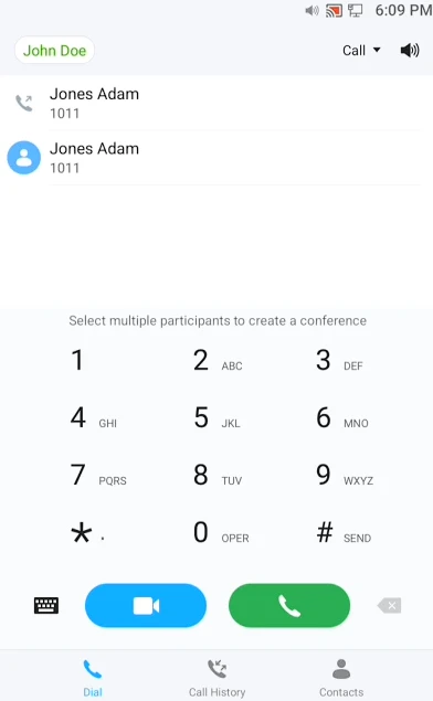 Dialer screen with John Doe contact, numeric keypad, and blue video plus green call buttons at bottom.